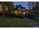 Charming two-story home with a welcoming front porch, well-manicured lawn, and traditional architectural details at 907 Eden Se Ave, Atlanta, GA 30316