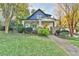 Charming home featuring a welcoming front porch, lush lawn, and mature landscaping, inviting curb appeal at 907 Eden Se Ave, Atlanta, GA 30316