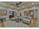 Spacious living room featuring hardwood floors, a large sectional, and ample natural light at 907 Eden Se Ave, Atlanta, GA 30316