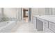 Bathroom featuring tiled floors, double doors, and a tiled bathtub at 2030 Brook Meadow Dr, Alpharetta, GA 30005