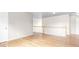 Open bonus room with bright wood floors and white banister at 2030 Brook Meadow Dr, Alpharetta, GA 30005