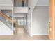 Bright entryway featuring hardwood floors, staircase, and views into multiple rooms at 2030 Brook Meadow Dr, Alpharetta, GA 30005