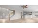 Open floor plan showcases living room flowing into the kitchen with white cabinets at 2030 Brook Meadow Dr, Alpharetta, GA 30005