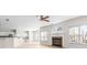 Open-concept living room featuring a fireplace and hardwood floors, and natural light at 2030 Brook Meadow Dr, Alpharetta, GA 30005