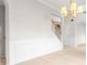 Open living room with hardwood floors, chandelier, and white trim at 2030 Brook Meadow Dr, Alpharetta, GA 30005