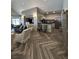 Open concept kitchen and living area with stainless steel appliances, modern countertops and a breakfast bar at 211 Colonial Homes Nw Dr # 2304, Atlanta, GA 30309