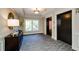 Well-lit lobby area featuring elevator access and a view of the exterior through a large picture window at 211 Colonial Homes Nw Dr # 2304, Atlanta, GA 30309