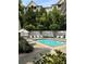 Outdoor pool surrounded by lounge chairs and lush landscaping, providing a relaxing and private setting at 211 Colonial Homes Nw Dr # 2304, Atlanta, GA 30309