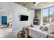 Bedroom featuring a modern design, exposed concrete, and large windows at 855 Peachtree Ne St # 2309, Atlanta, GA 30308