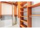 Well-organized walk-in closet with custom shelving and ample storage at 855 Peachtree Ne St # 2309, Atlanta, GA 30308