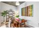 Inviting dining room with stylish decor, featuring a wooden table, seating for four, and a decorative accent wall art at 855 Peachtree Ne St # 2309, Atlanta, GA 30308
