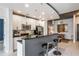 Well-lit kitchen with white cabinetry, stainless steel appliances, and bar seating at 855 Peachtree Ne St # 2309, Atlanta, GA 30308