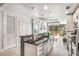 Modern kitchen featuring an eat-in island and stainless steel appliances, seamlessly connected to an adjoining living space at 855 Peachtree Ne St # 2309, Atlanta, GA 30308