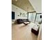 Stylish living room featuring hardwood floors, large windows, and sleek furnishings at 855 Peachtree Ne St # 2309, Atlanta, GA 30308