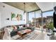 Modern living area with large windows and a cozy sectional sofa at 855 Peachtree Ne St # 2309, Atlanta, GA 30308