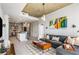 Open-concept living area with a modern decor, concrete ceilings and seamless flow to the kitchen at 855 Peachtree Ne St # 2309, Atlanta, GA 30308