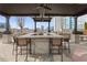 Outdoor bar and seating area with a built-in grill offering stunning city views for entertaining at 855 Peachtree Ne St # 2309, Atlanta, GA 30308