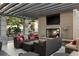 Outdoor lounge area featuring comfortable seating, a fireplace, and an outdoor television perfect for relaxing and entertaining at 855 Peachtree Ne St # 2309, Atlanta, GA 30308