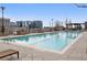 Stunning rooftop pool with lounge chairs and pergola overlooking the city skyline at 855 Peachtree Ne St # 2309, Atlanta, GA 30308