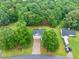 Aerial view of the property featuring the home and surrounding lush greenery at 240 Mountain Ln, Covington, GA 30016