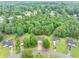 An aerial view of the property, showcasing the home nestled among lush trees at 240 Mountain Ln, Covington, GA 30016
