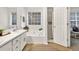 Bathroom features a soaking tub, separate shower, and a window providing lots of natural light at 240 Mountain Ln, Covington, GA 30016