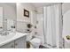 Well-maintained bathroom with a shower-tub combo, clean vanity, and classic fixtures, offering a refreshing and functional space at 240 Mountain Ln, Covington, GA 30016