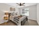 Bedroom featuring a standard bed, neutral walls, carpeted floor, and a ceiling fan at 240 Mountain Ln, Covington, GA 30016