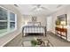 Well-lit bedroom featuring neutral walls, carpet floors, and a window with natural light at 240 Mountain Ln, Covington, GA 30016