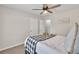 Comfortable bedroom featuring a ceiling fan and neutral color scheme at 240 Mountain Ln, Covington, GA 30016
