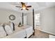 Comfortable bedroom showcasing a four-poster bed, stylish décor, and neutral color palette at 240 Mountain Ln, Covington, GA 30016
