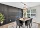 Contemporary dining room features modern light fixture and decorative wall paneling at 240 Mountain Ln, Covington, GA 30016