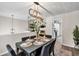 Contemporary dining room features modern light fixture and decorative wall paneling at 240 Mountain Ln, Covington, GA 30016