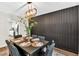 Contemporary dining room features modern light fixture and decorative wall paneling at 240 Mountain Ln, Covington, GA 30016