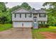 Charming two-story home with a two-car garage and well-maintained front lawn at 240 Mountain Ln, Covington, GA 30016