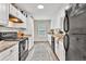 Bright, eat-in kitchen with stainless steel appliances and lots of cabinet space at 240 Mountain Ln, Covington, GA 30016