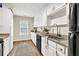 Spacious kitchen with ample cabinet space, granite counters, and stainless steel sink at 240 Mountain Ln, Covington, GA 30016