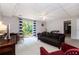 Finished basement featuring neutral carpeting, a comfortable seating area and sliding glass doors for easy outdoor access at 2960 Cedar Knoll Dr, Roswell, GA 30076