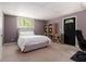 Basement bedroom featuring soft carpet, a bright window, and furnishings that provide a comfortable and private space at 2960 Cedar Knoll Dr, Roswell, GA 30076