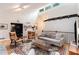 Open living room boasts vaulted ceilings, ample natural light, a decorative rug and comfortable seating at 2960 Cedar Knoll Dr, Roswell, GA 30076