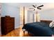 A large main bedroom features wood floors and ensuite bathroom at 2960 Cedar Knoll Dr, Roswell, GA 30076