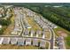 Community aerial displays a well-planned neighborhood with a scenic treeline in the background at 96 Quail Bend Way, Dallas, GA 30157