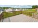 View from a wooden back deck with a railing overlooking green space at 96 Quail Bend Way, Dallas, GA 30157
