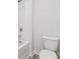 Bathroom features a new toilet and shower-tub combination at 96 Quail Bend Way, Dallas, GA 30157