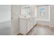 Bathroom featuring double sink vanity and bathtub at 96 Quail Bend Way, Dallas, GA 30157