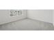 An empty bedroom with a carpeted floor and a window at 96 Quail Bend Way, Dallas, GA 30157