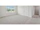 Spacious bedroom with a window and plush carpeting at 96 Quail Bend Way, Dallas, GA 30157