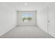 Bedroom featuring carpeting, a window view, and a bright interior at 96 Quail Bend Way, Dallas, GA 30157
