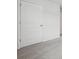 Neutral carpeting leading to a white paneled door with hardware at 96 Quail Bend Way, Dallas, GA 30157