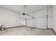 Spacious garage with an automatic door opener and concrete floors at 96 Quail Bend Way, Dallas, GA 30157